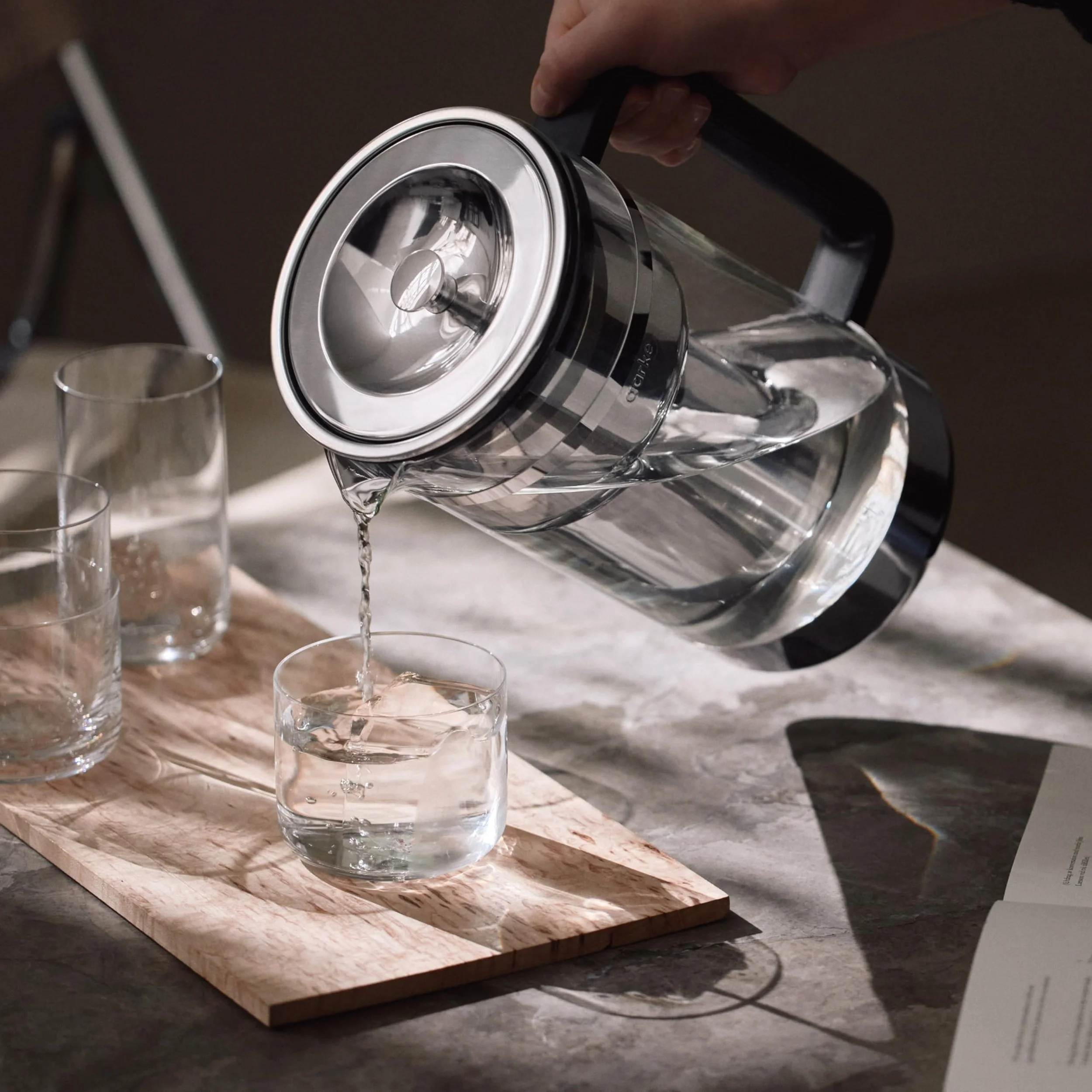 Water poured in to a glass from an Aarke water filter