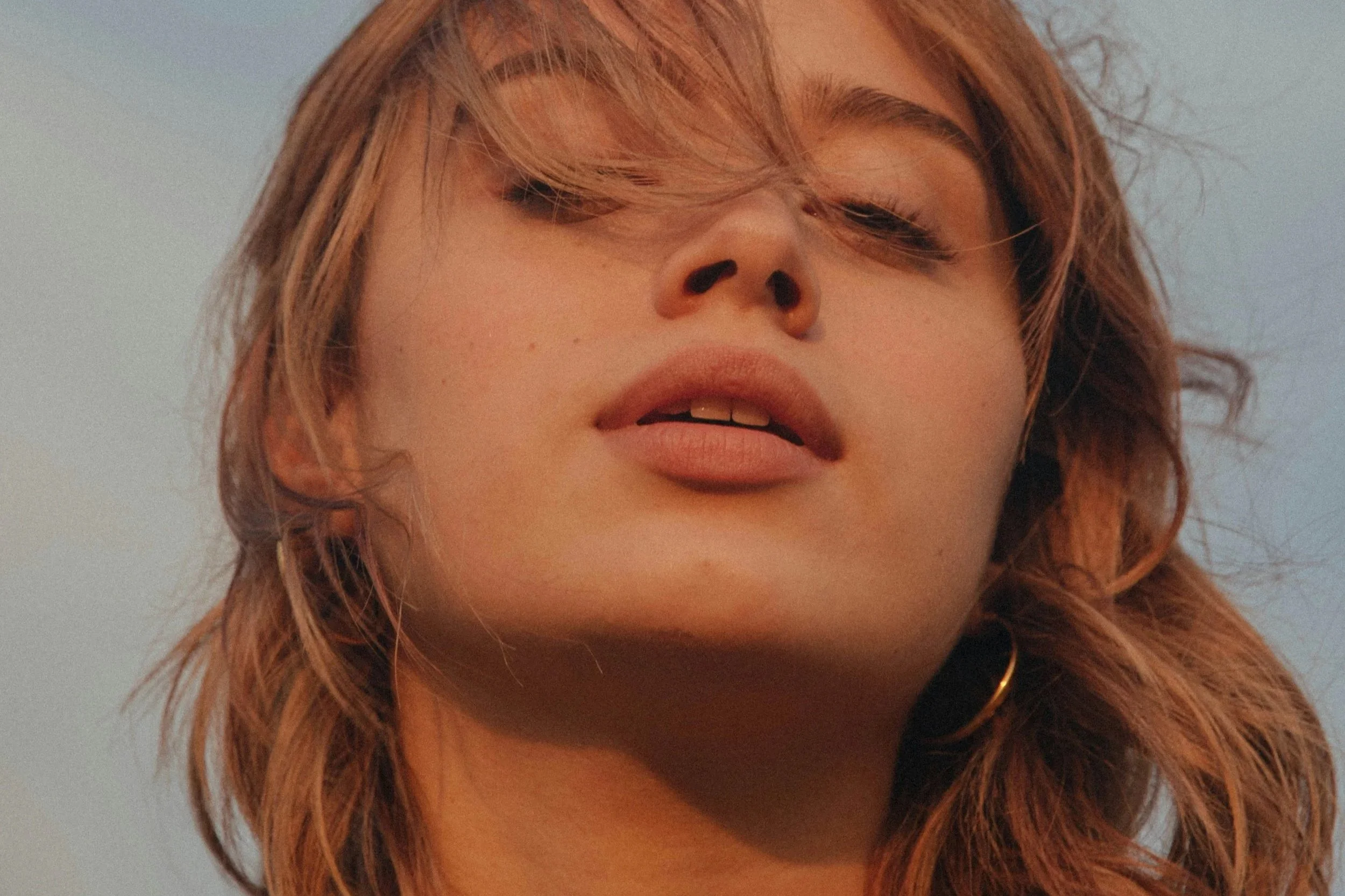 Close-up portrait of woman with naturally full lips illustrating collagen-stimulating Laser Lip Lift treatment