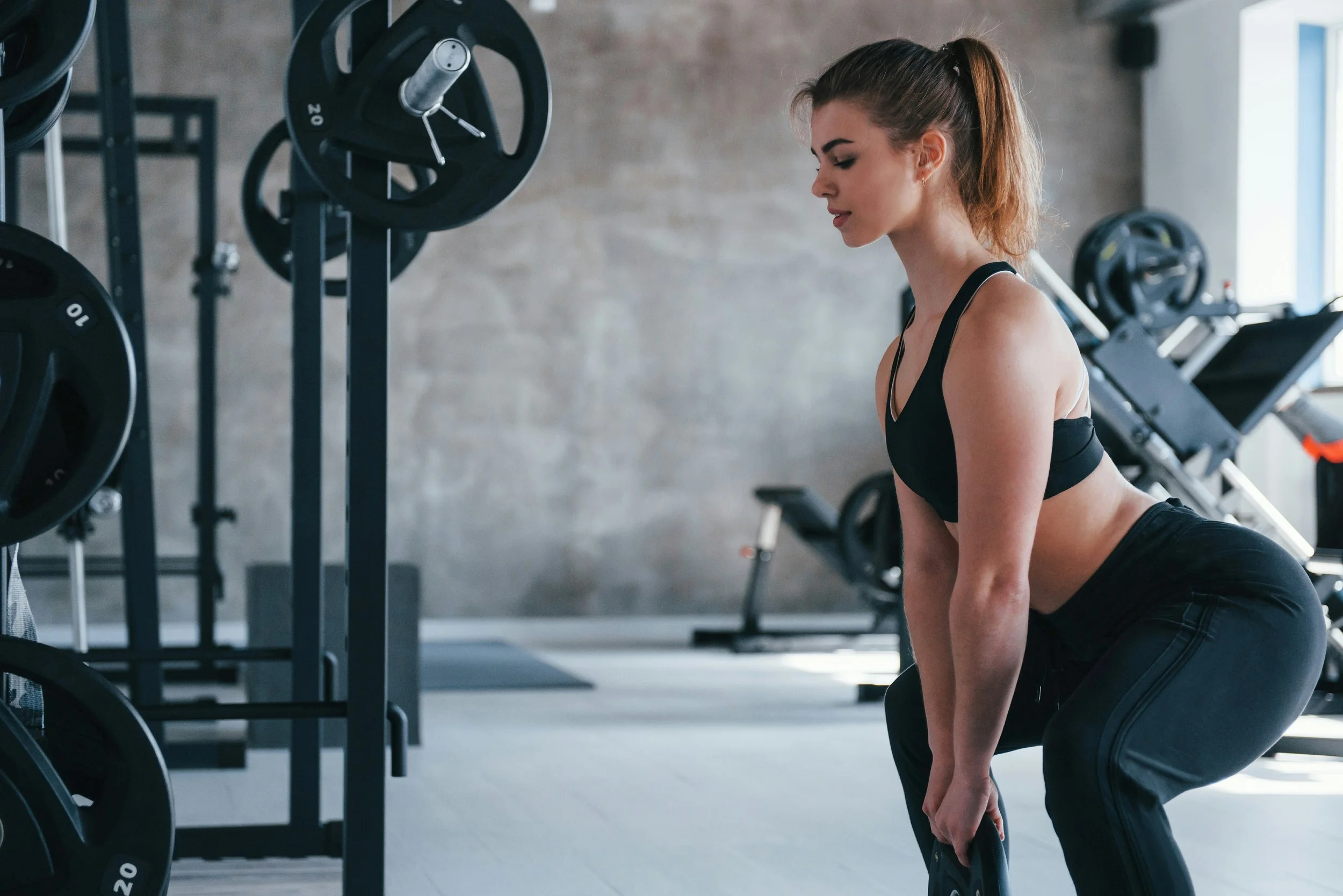 Woman performing a deadlift during a strength workout