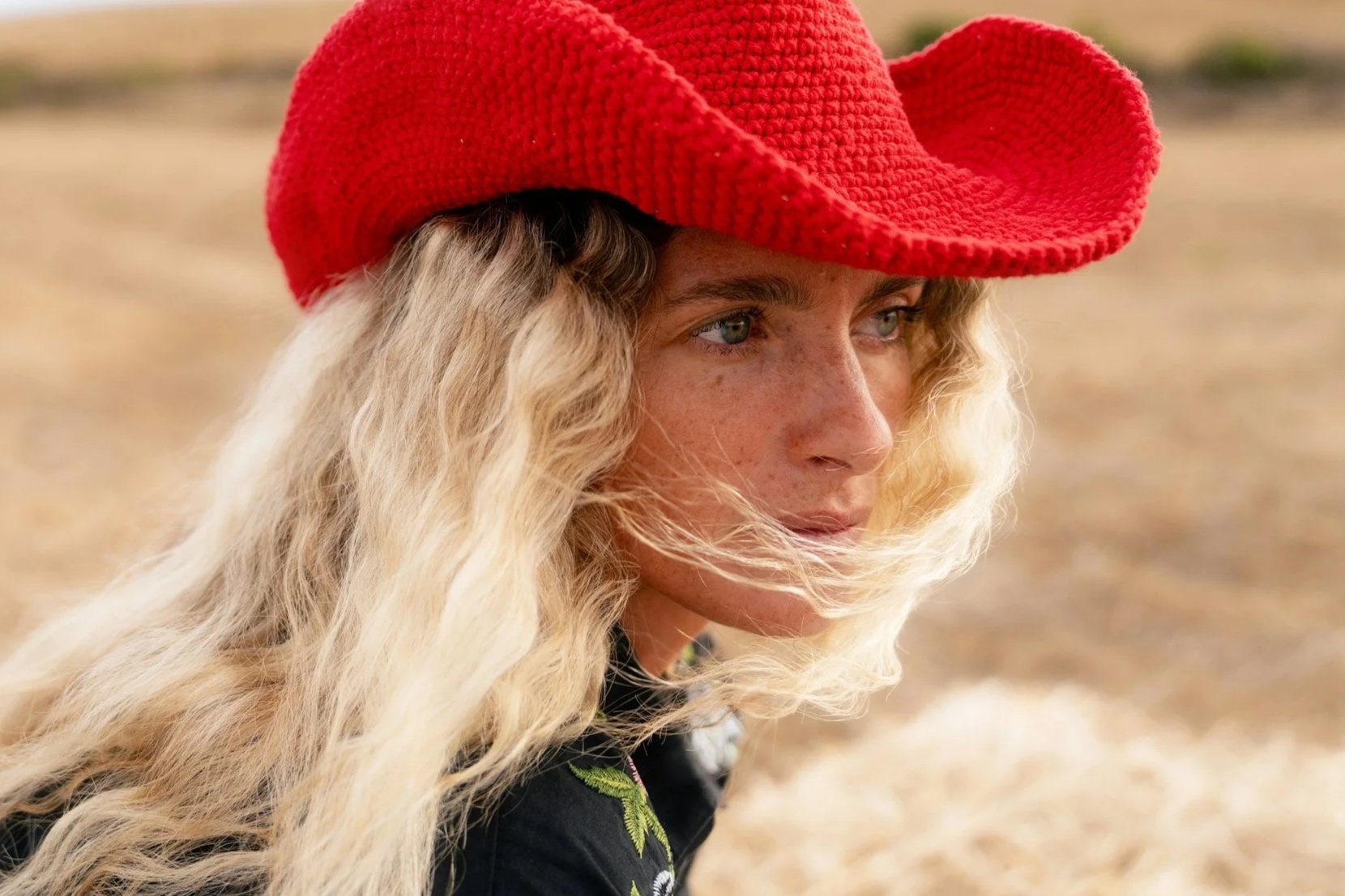 Freckled skin in sunlight showing natural texture and pigmentation, illustrating vitamin C benefits for brighter, more even skin