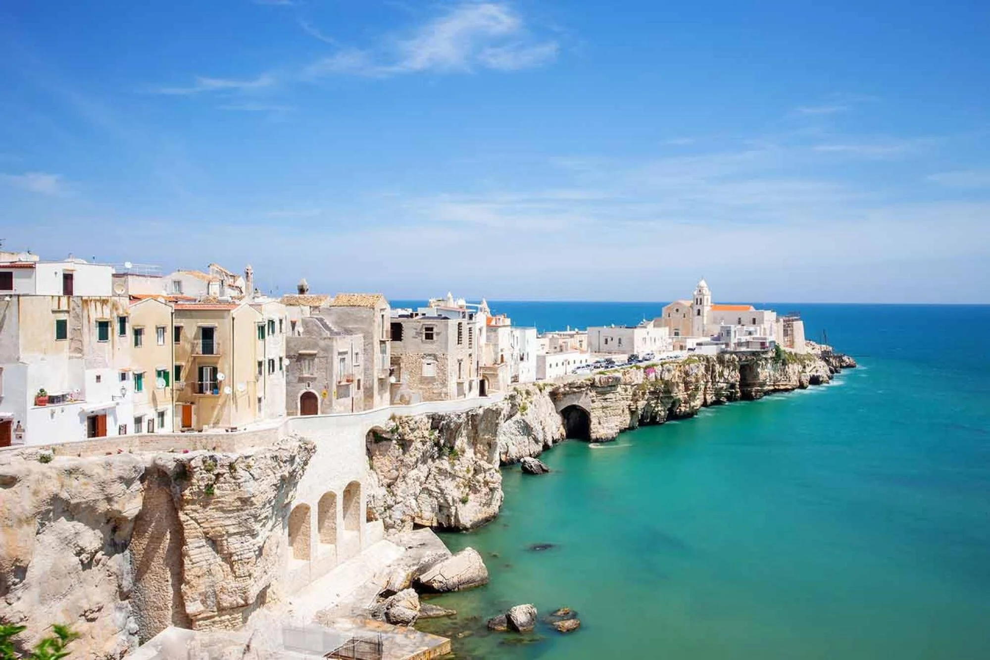 Whitewashed coastal town overlooking the Adriatic Sea in Puglia, Italy.