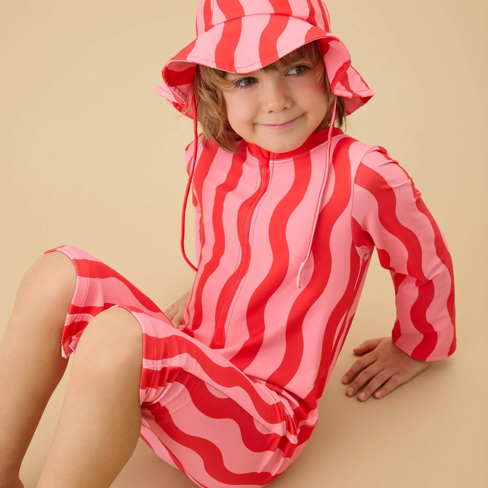 Child wears Kidly by MORI's UPF Swimwear Collection