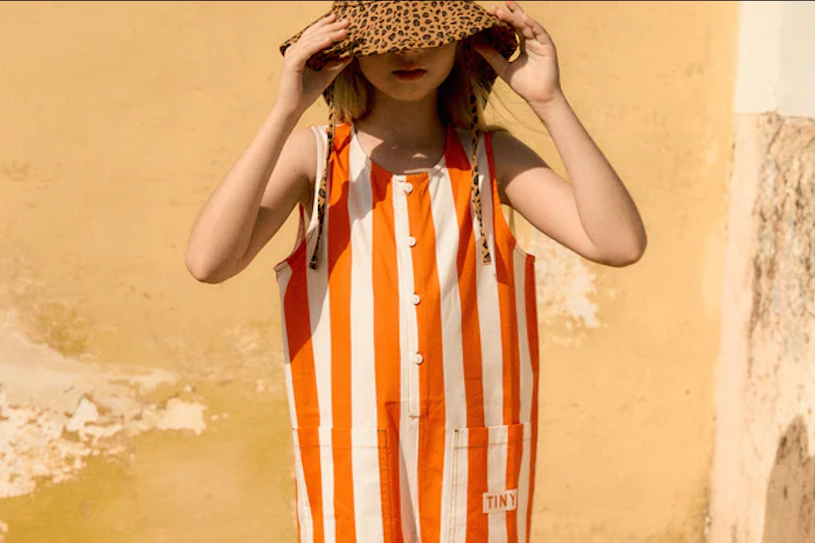 Ando Stores children’s striped summer dress orange tones minimal kidswear fashion