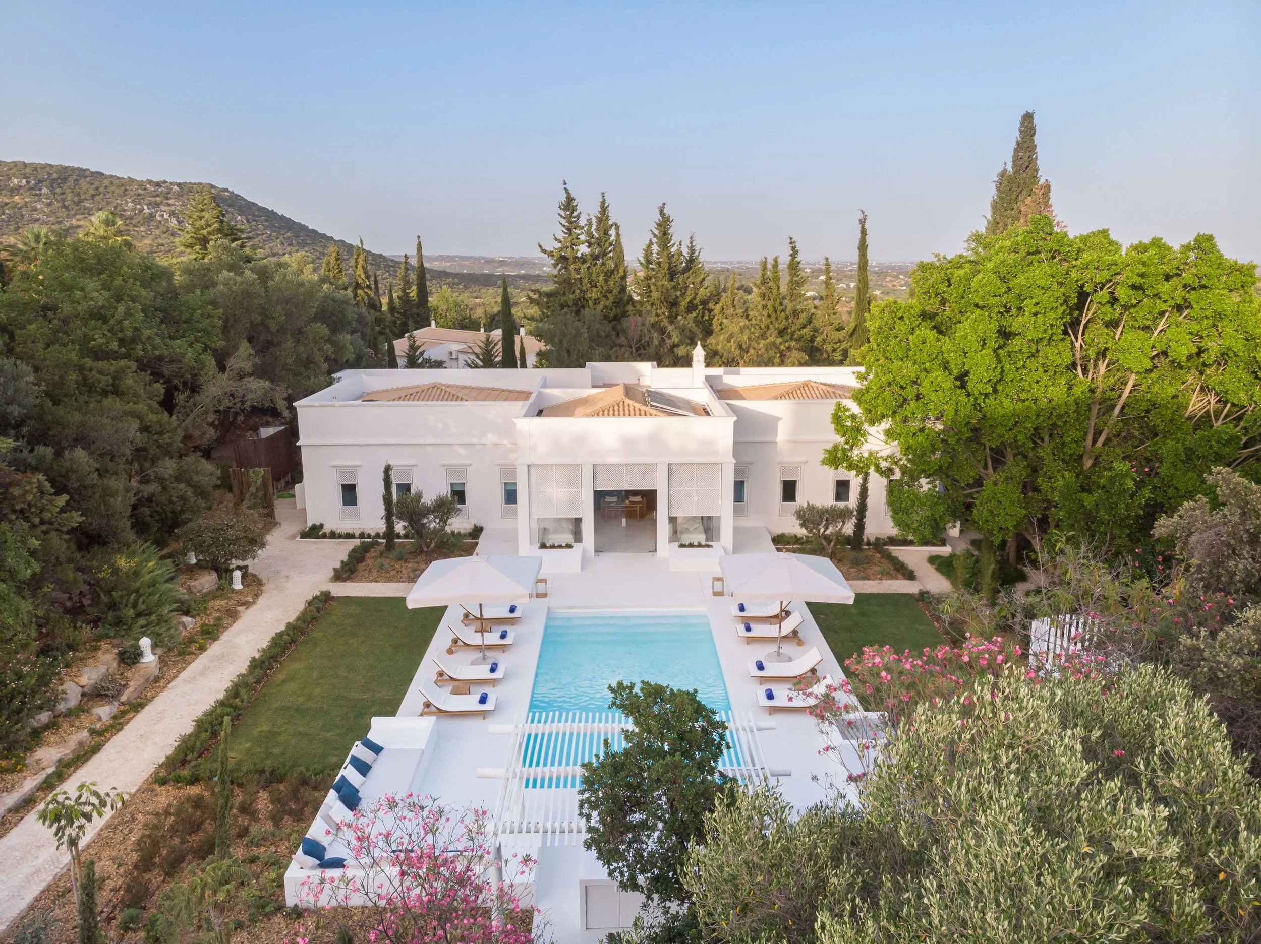 Whitewashed Octant Vila Monte hotel surrounded by gardens in the eastern Algarve.