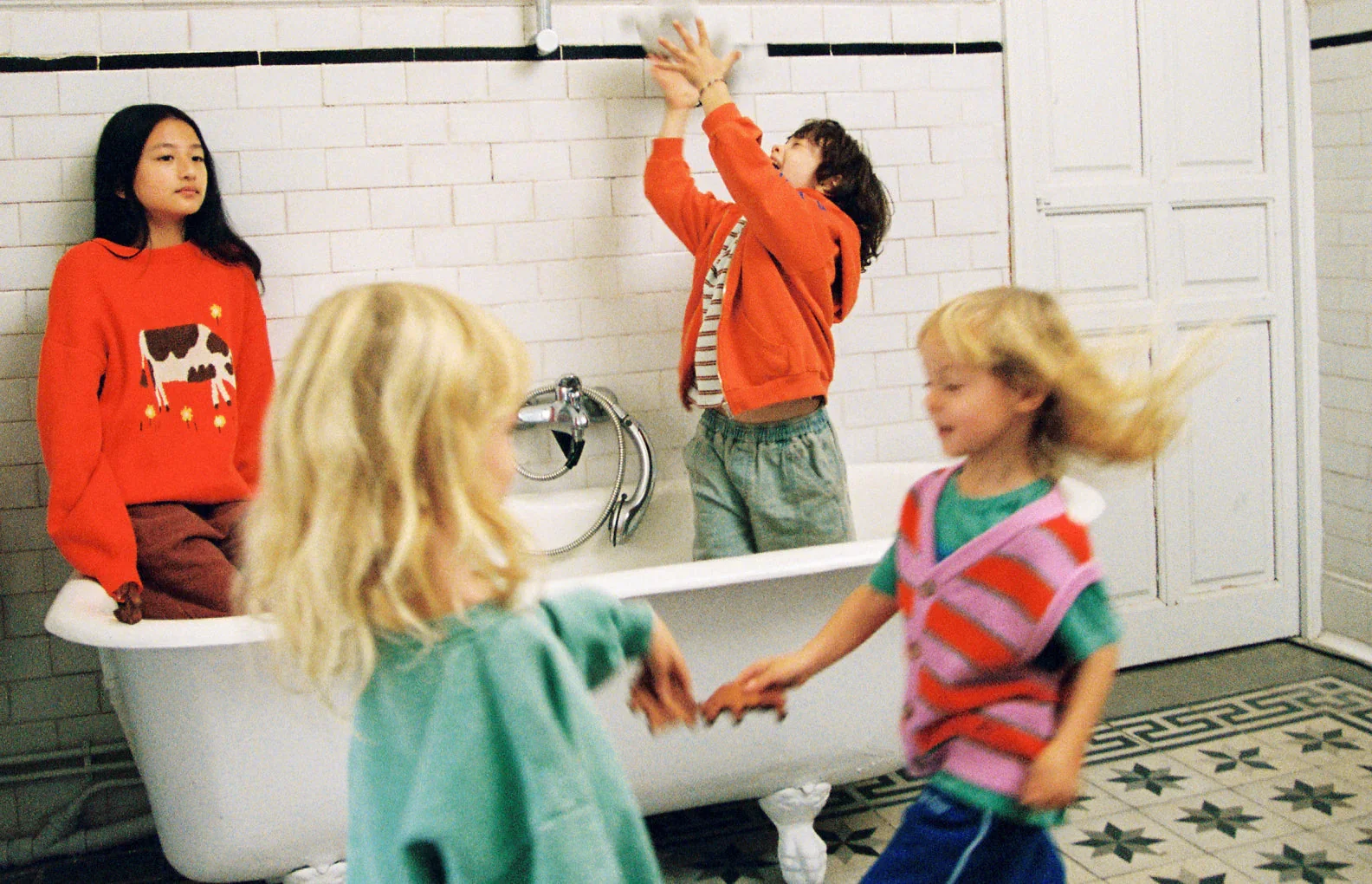 Bobo Choses children playing in bathroom colourful kidswear playful graphic clothing
