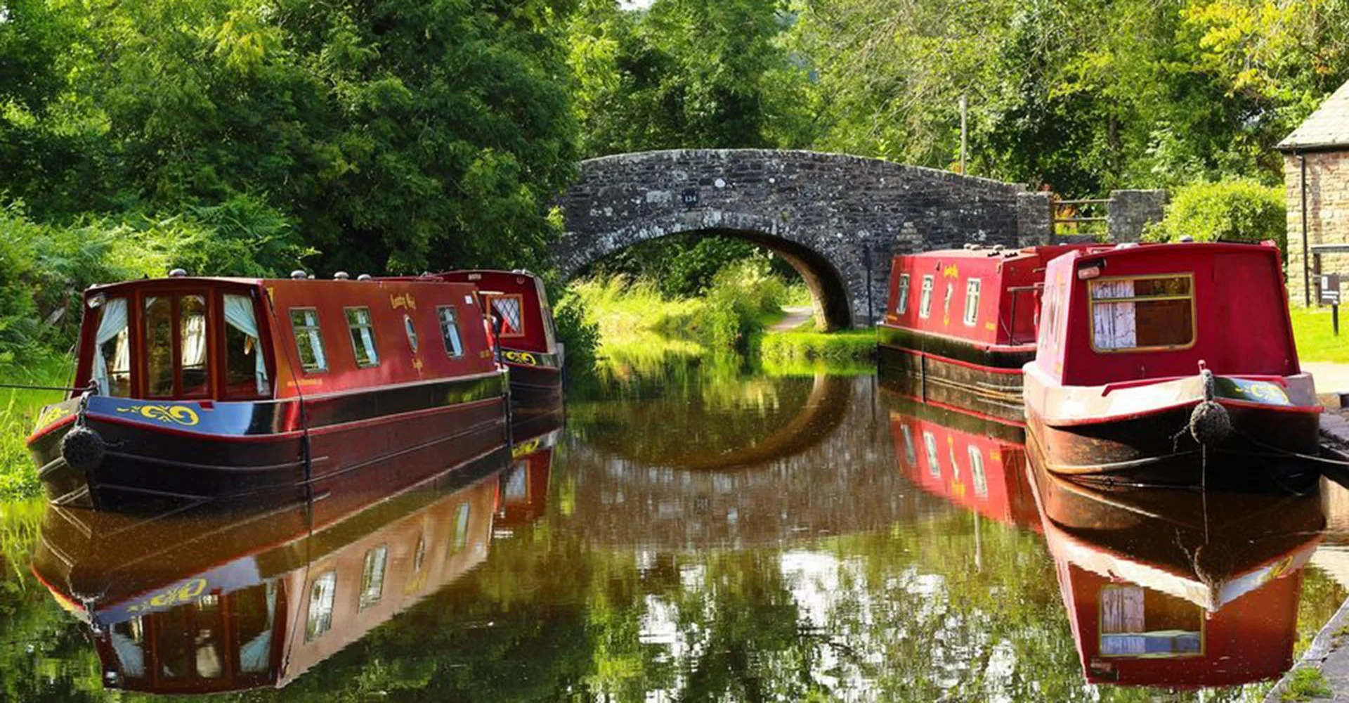 Two narrow boats in the canals, part of narrowboat holidays in Wales