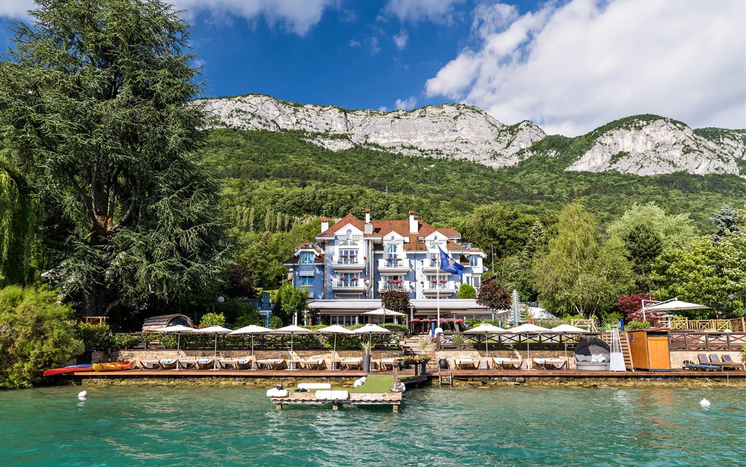 Auberge du Père Bise overlooking the crystal-clear waters of Lake Annecy in the French Alps