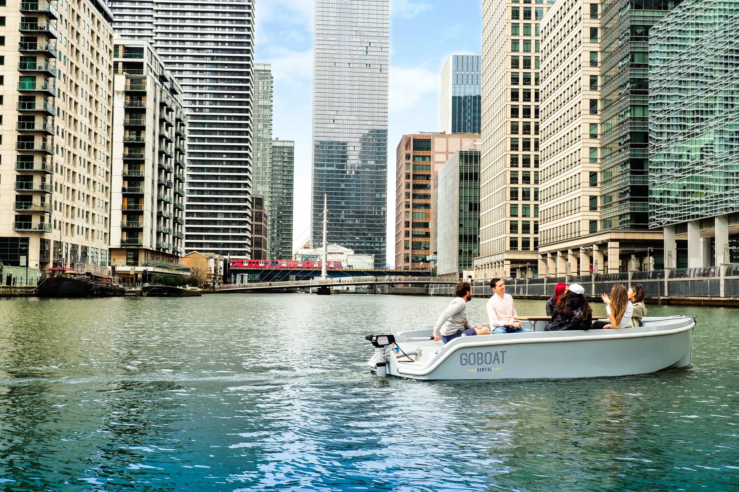 Friend diving a GOBOAT in Canary Wharf surrounded by Sky Scrapers.