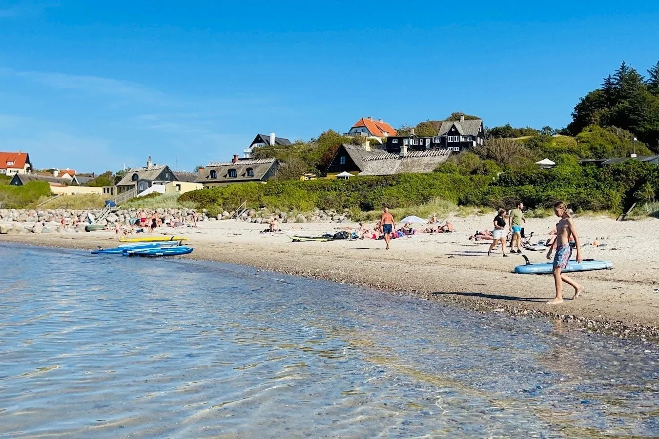 Danish Riviera coastline near Tisvilde with families enjoying the beach in summer