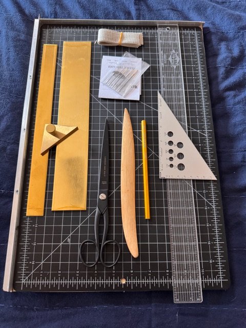 Book Binding__Tools on cutting mat.jpeg