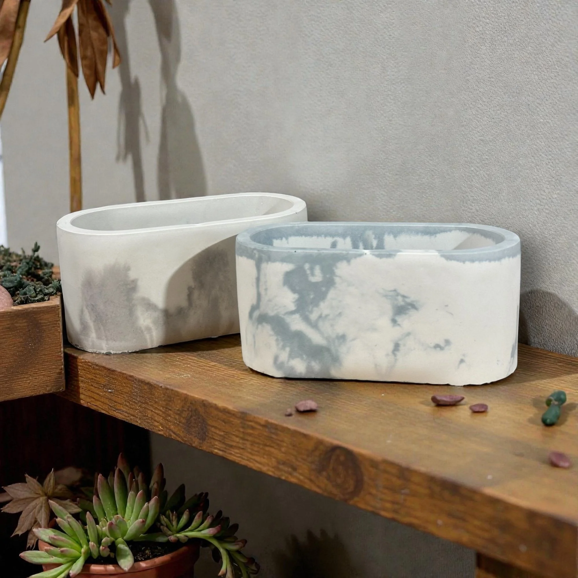 Obround-shaped handmade cement vessel for candles