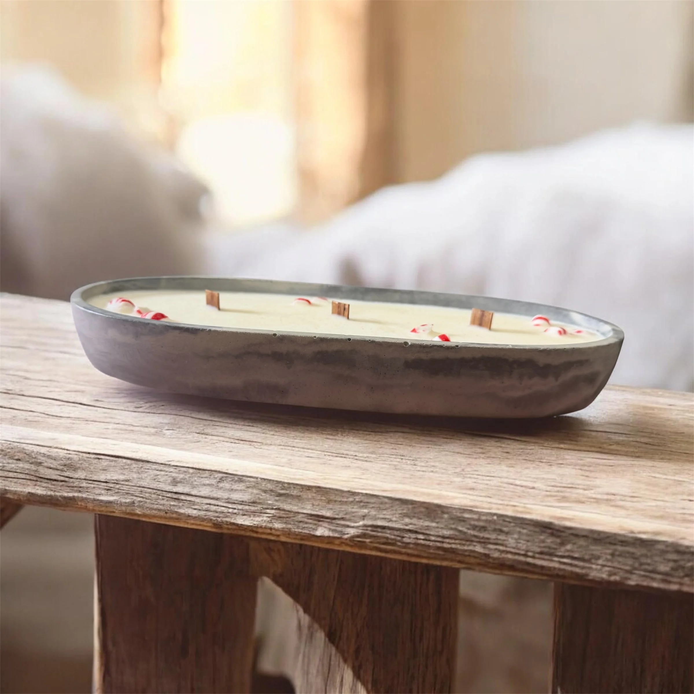 Large soy wax candle with three wood wicks, and a handmade cement vessel.