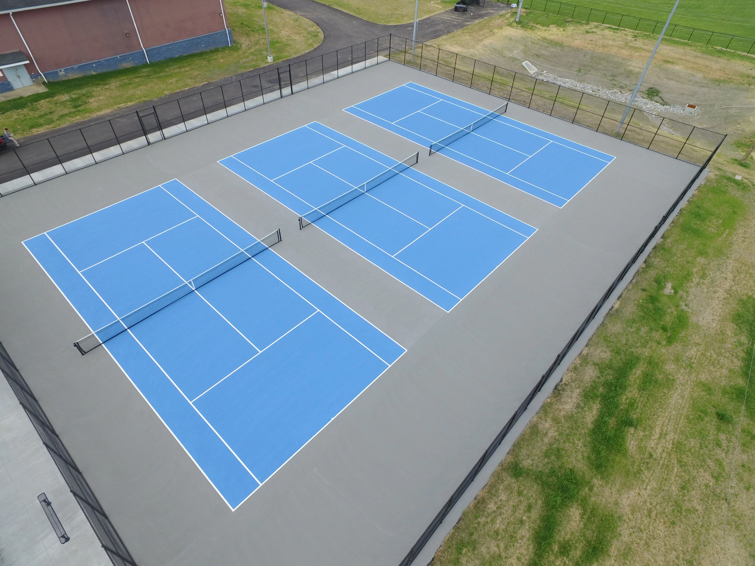 Light Blue and Gray Tennis Courts.JPG