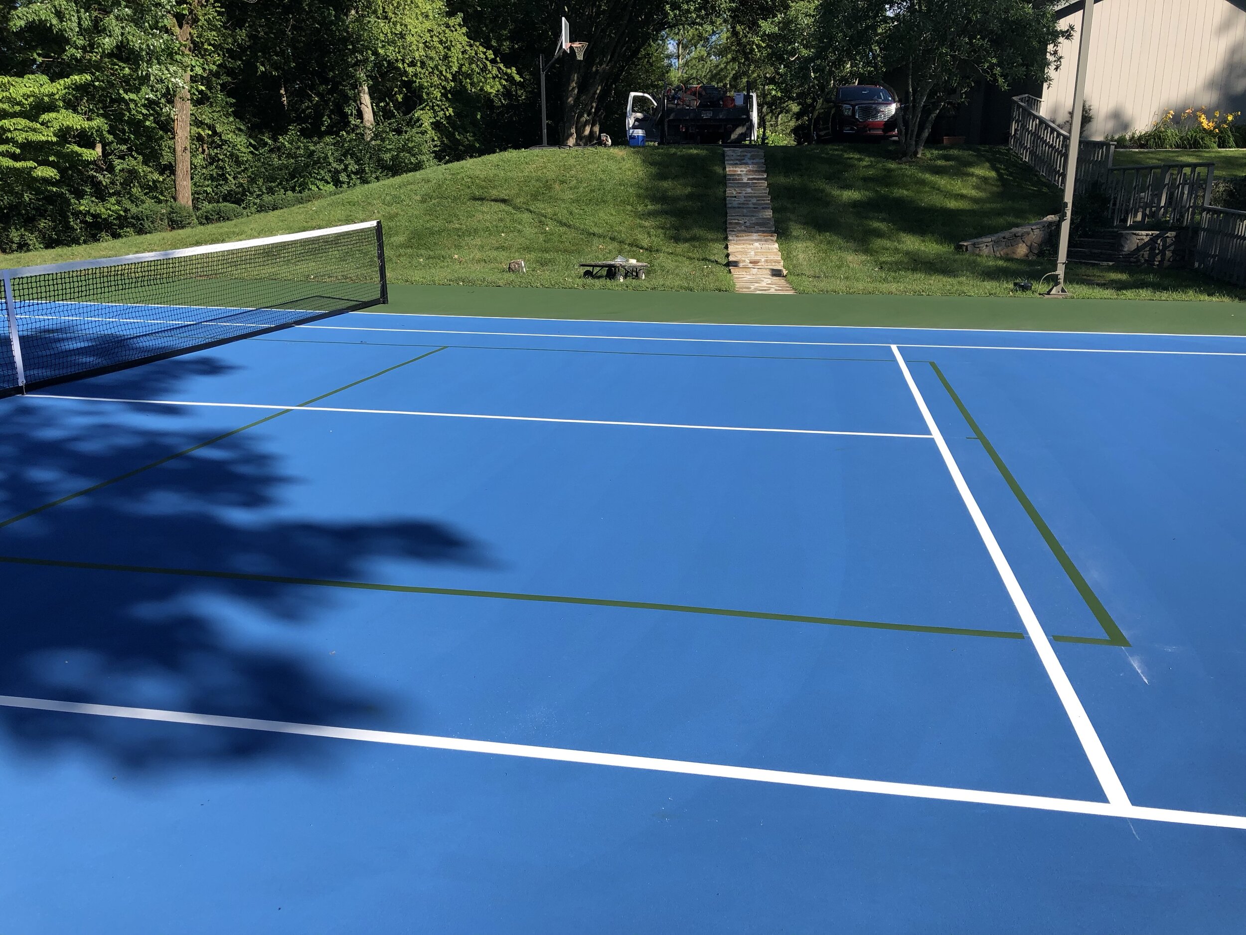 Green Pickleball Lines on Blue Tennis Court.jpeg
