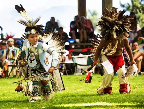 Photo from Wallowa County Chieftain: Lewis Allen, a Nez Perce of Lapwaii, Idaho, competes with another dancer in the Junior Boy’s Traditional dance at the 2018 Tamkaliks.