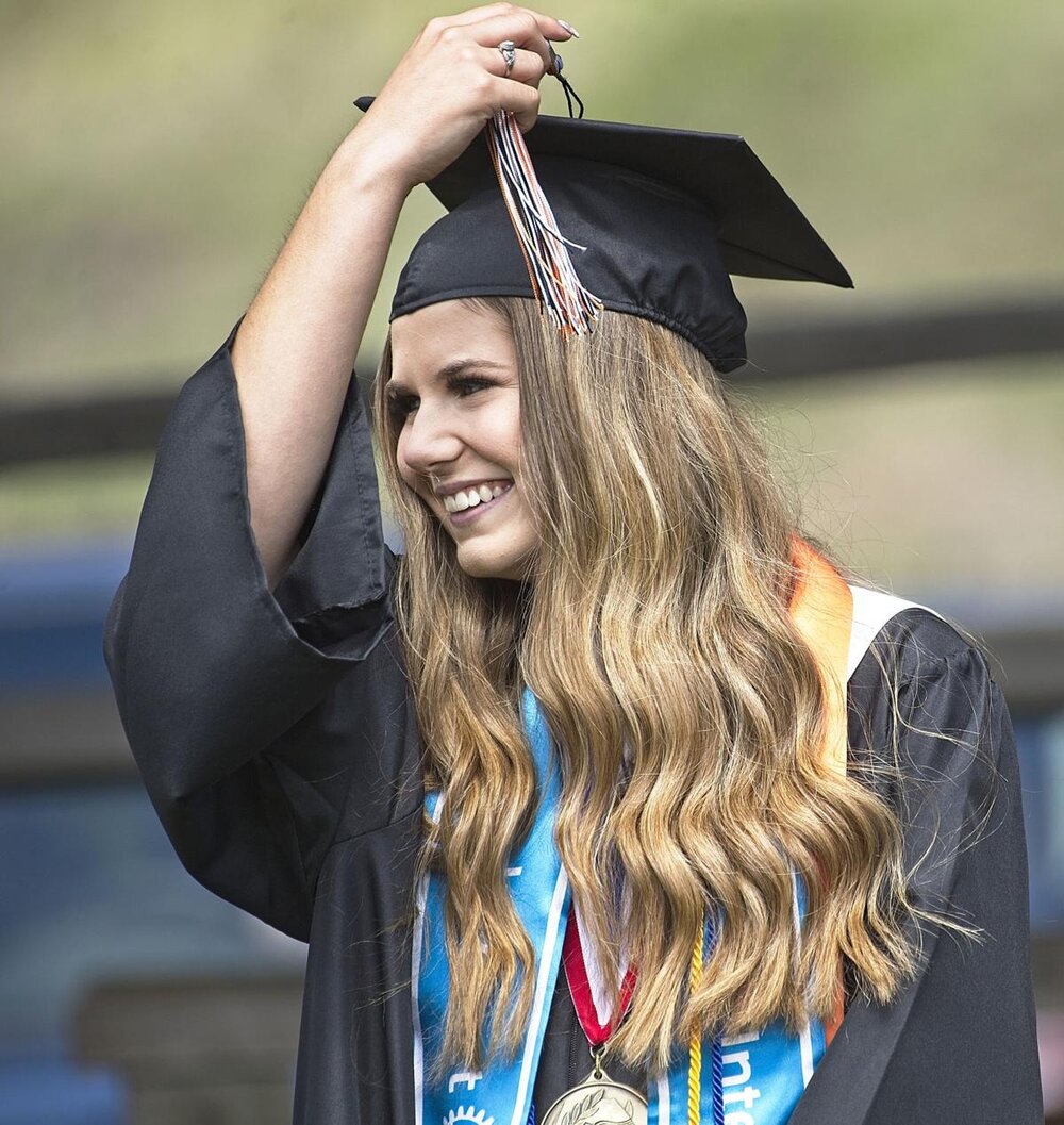  Valedictorian Ashlyn Young flips her tassel signifying that she’s transformed from a student to an alum.  