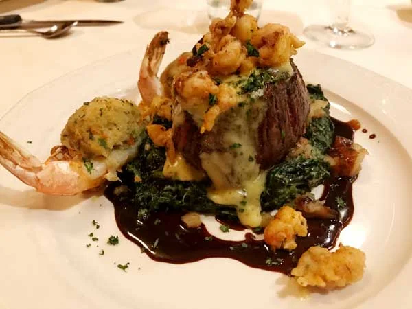 had the House Filet: an 8 oz prime filet on creamed spinach and house potatoes, topped with fried crawfish tails and bearnaise sauce on a port wine demi glace, with an added crab-stuffed shrimp.