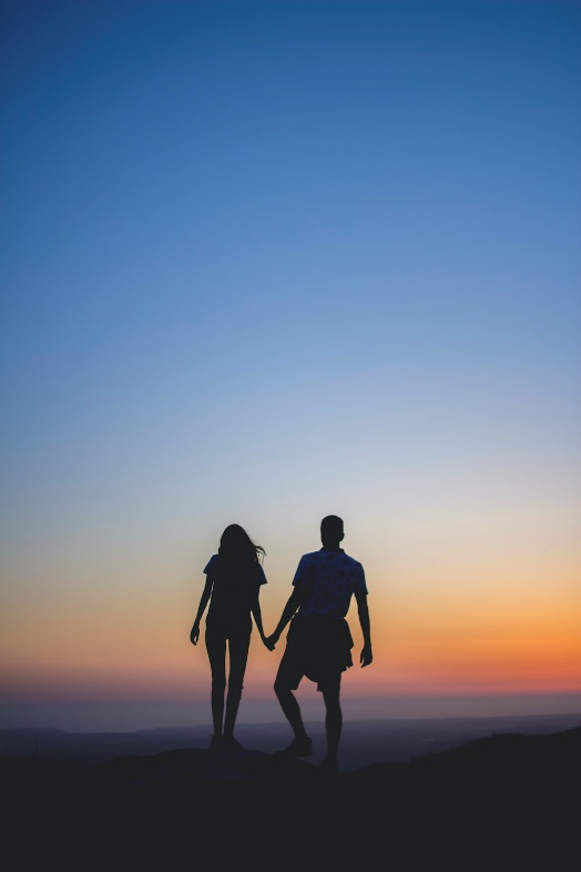 A couple holding hands.