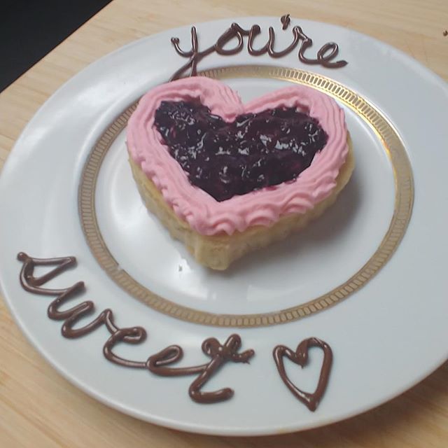 Serve up a tasty Valentine's Day breakfast the whole family will LOVE with these heart shaped pancakes decorated with pink whipped cream, nutella, and berry compote. YUM! Check out the recipe on the blog. Link in bio.