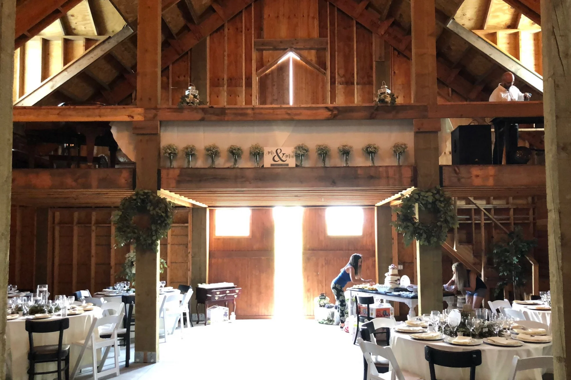 A view of the interior of the Barn Stall Winery & Wedding Barn. The 12x10 foot loft and beautiful lighting from the barn's many windows.