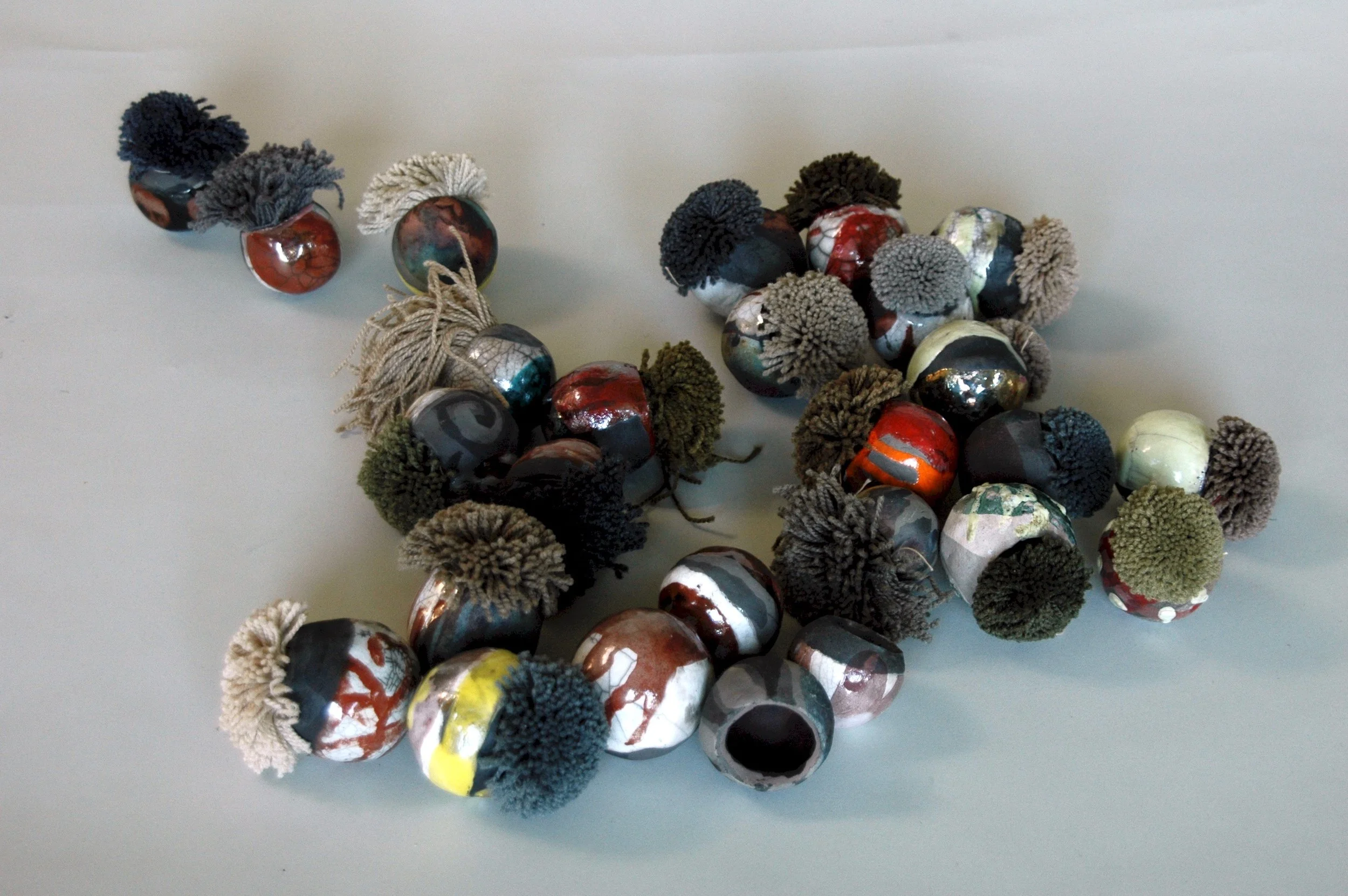Symbiosis: echinoderms, sea urchins, were my inspiration. Acclimating to new culture is like being at home with the strange and the discomforting and still learning to find ease with them. 2"h x 24"w x 24"d Clay, Carpet samples 2009