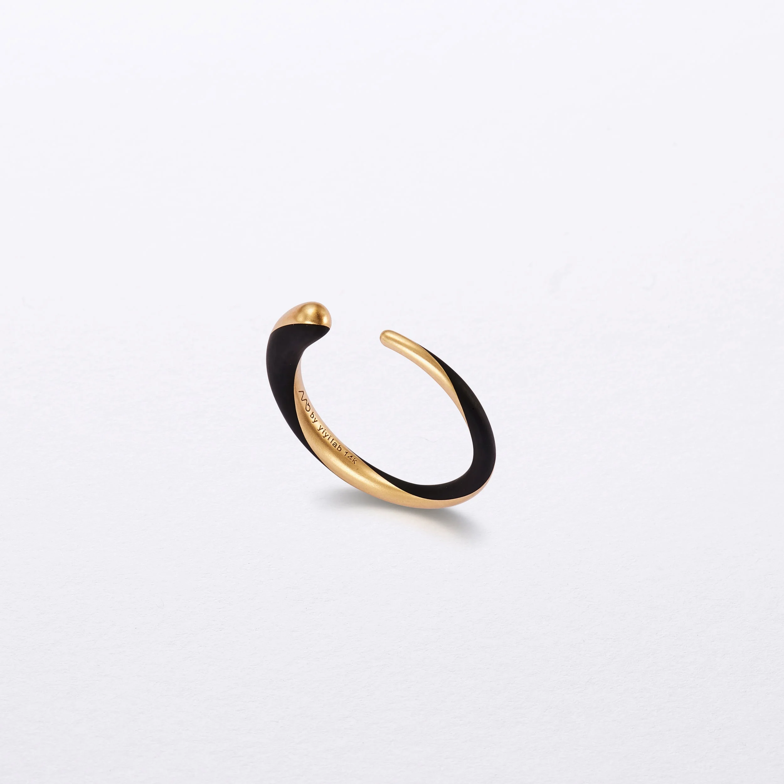 Black enamel and gold ring.