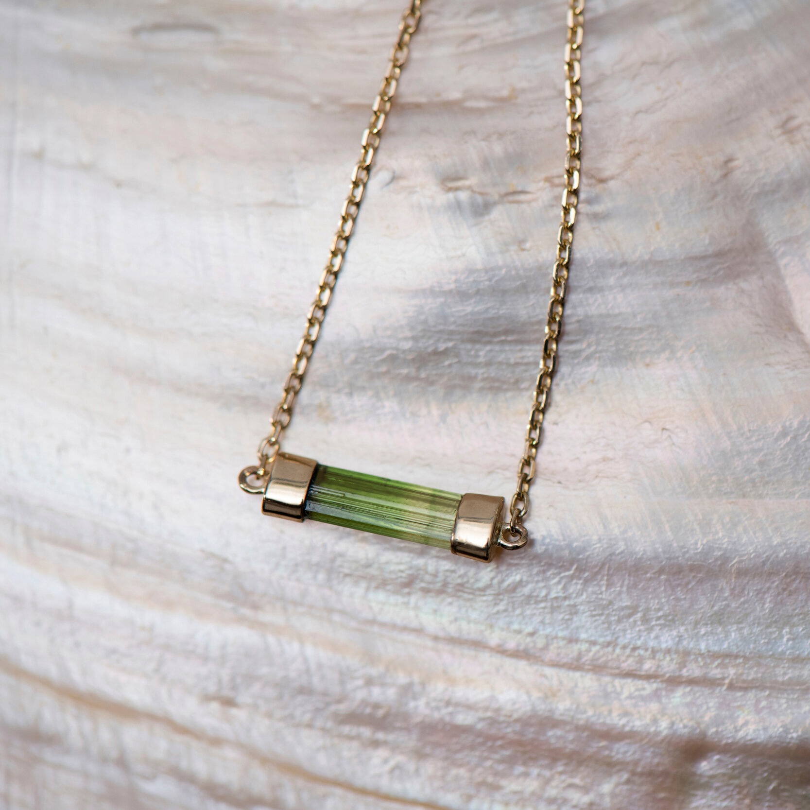 Tourmaline and gold pendant