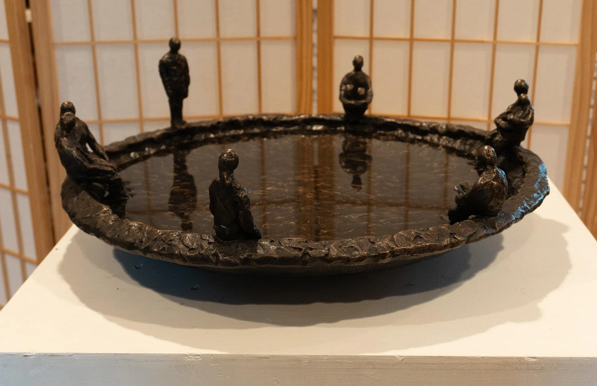   Linda Hoffman ,  Reflections  Bronze, 8 × 21 × 21 in. $7,500 