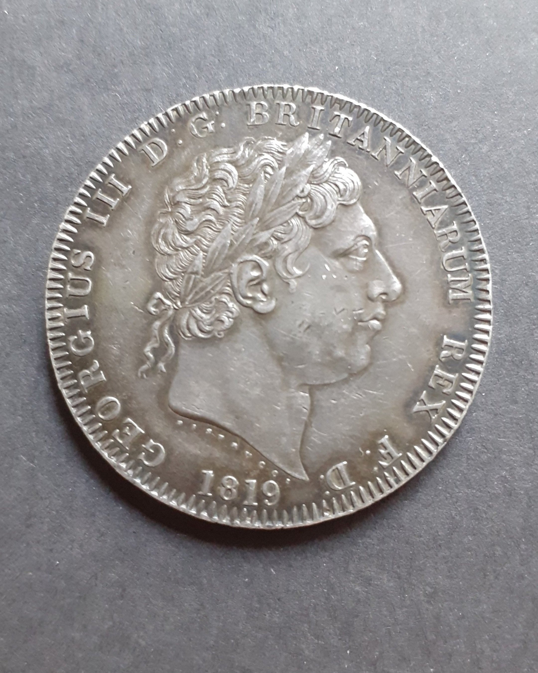 A George III 1819 LIX edge silver crown.
