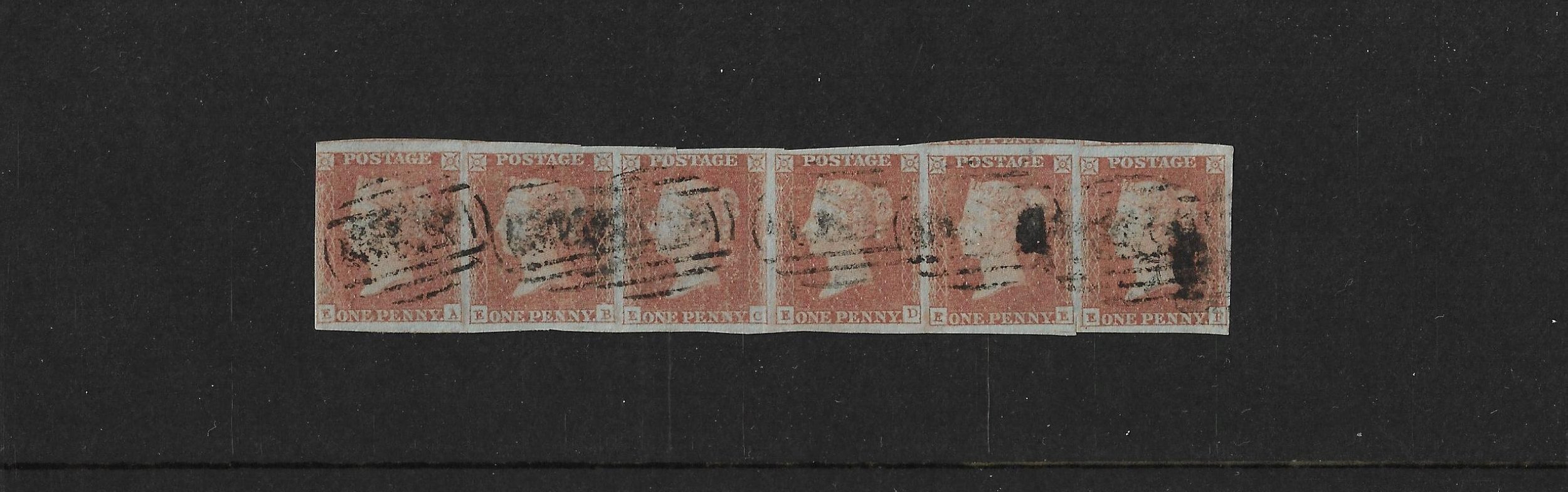 A strip of six Queen Victoria Penny Red stamps on blued paper lettered EA to EF.