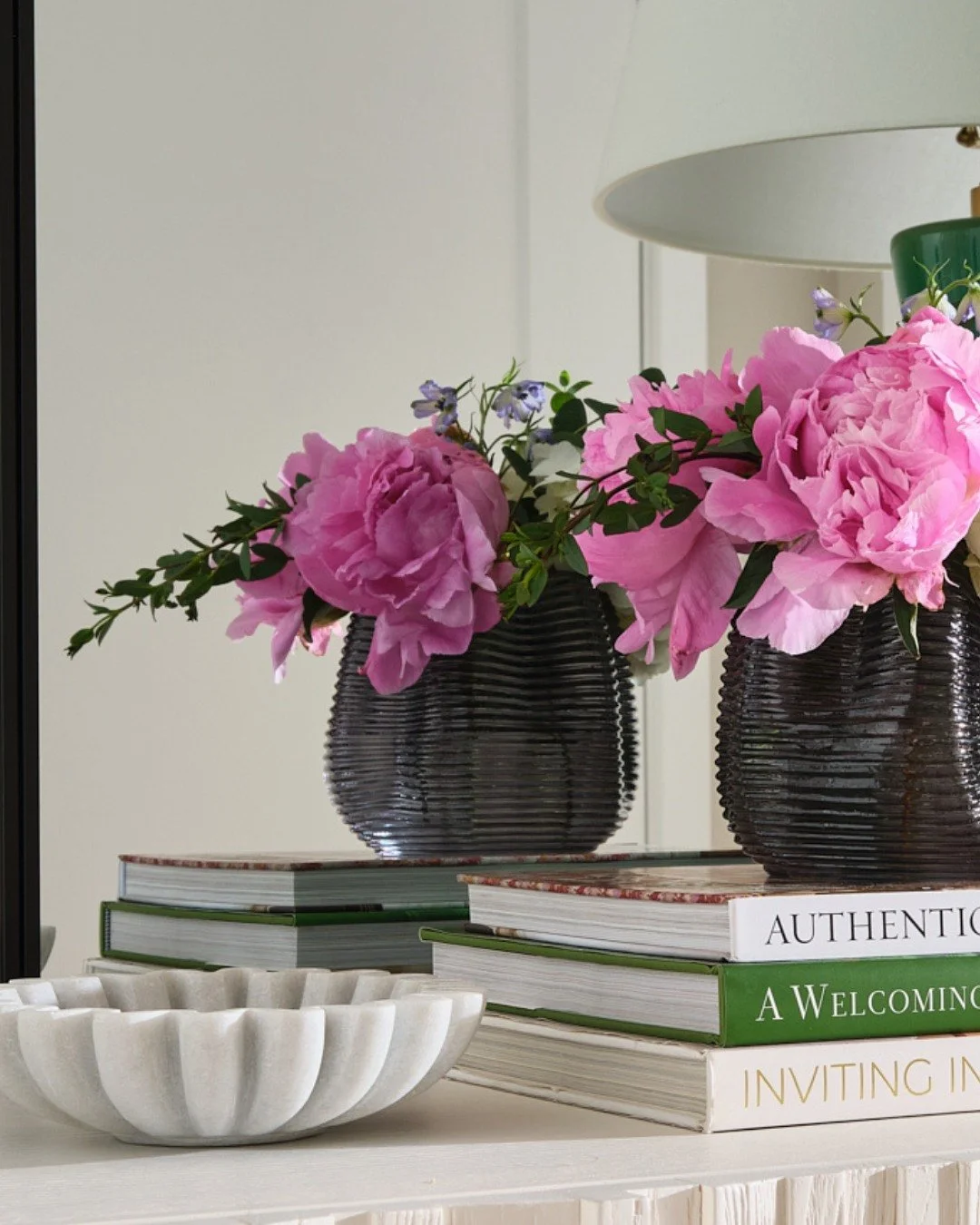 A bold first impression from our Georgia Avenue project.

As a secondary downtown residence, every piece in this condo was selected for its visual impact. In the Entry, sculptural forms, saturated color, and collected accents set the tone immediately