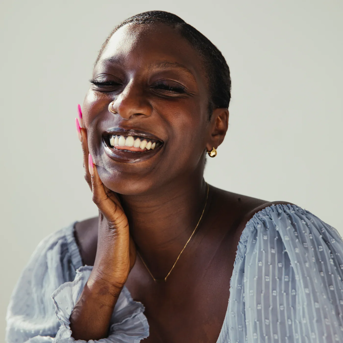 A portrait of hannahanna beauty founder smiling warmly, highlighting the personal and intentional roots of the women-owned skincare brand.