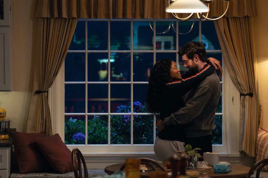 Keke Palmer and Jack Whitehall share an intimate moment inside their suburban home in The ’Burbs, highlighting the emotional core and modern relationship at the center of the Peacock mystery series.