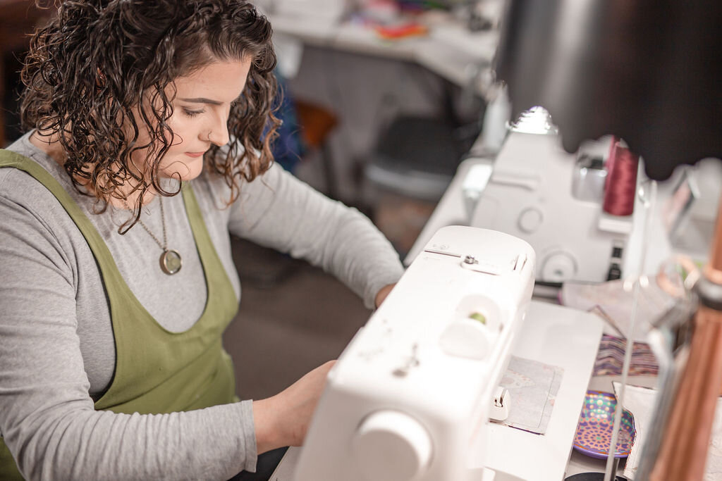 Christina sewing on one of her machines