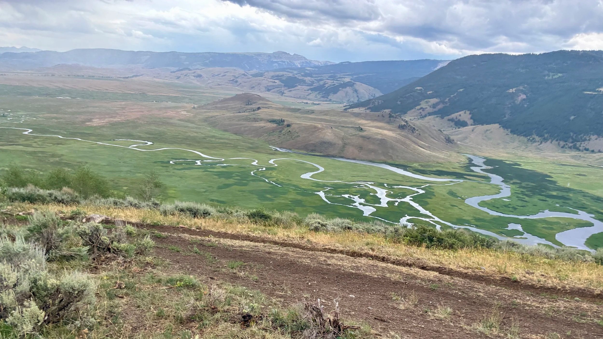 Winding river seen from atop a Wyoming ridge. The Scott Team