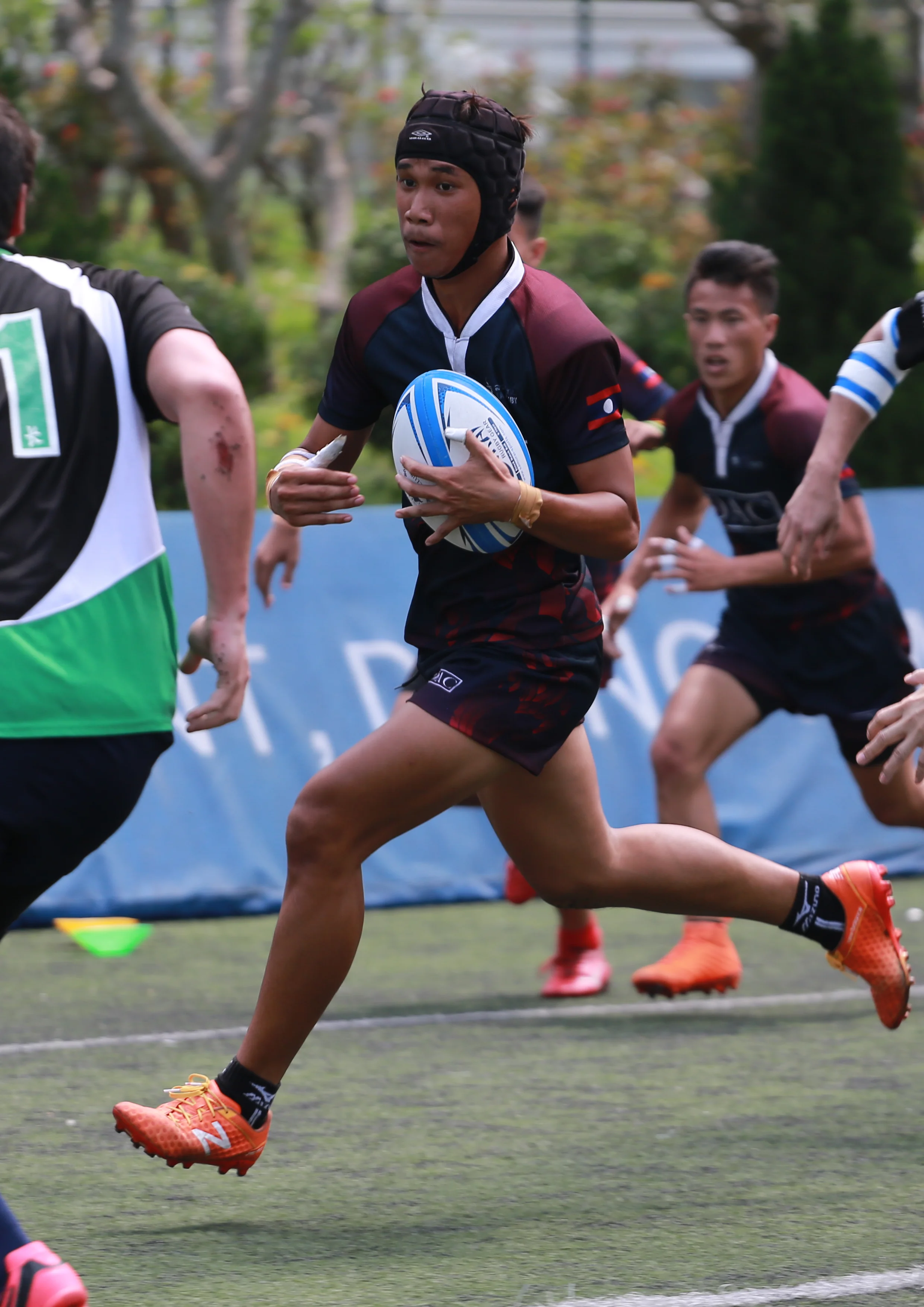 Joey works as a Champa Ban powered byChildFund Pass It Back youth rugby coach.
