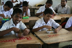 Boys enjoying their lunch provided by the Food Programme