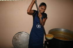 Serving lentils into buckets