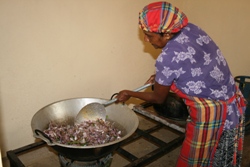 Cooking sprats with onions and banana flowers