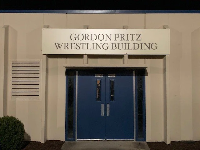 Entrance to the Gordon Pritz Wrestling Building with a sign above the door.