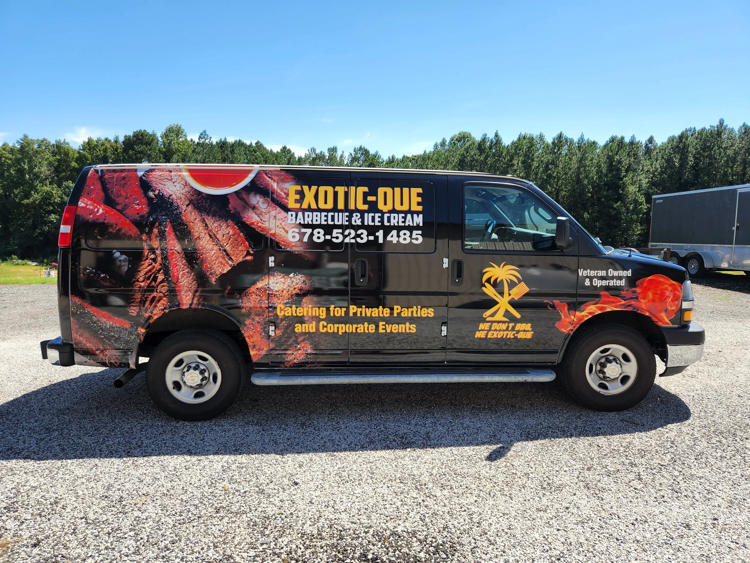 Black catering van with a large grill and meat graphics, displaying 'Exotic-Que Barbecue & Ice Cream,' phone number 678-523-1485, and text about catering private parties and events, featuring a palm tree logo and phrases 'We don't BBQ, We Exotic-Que,