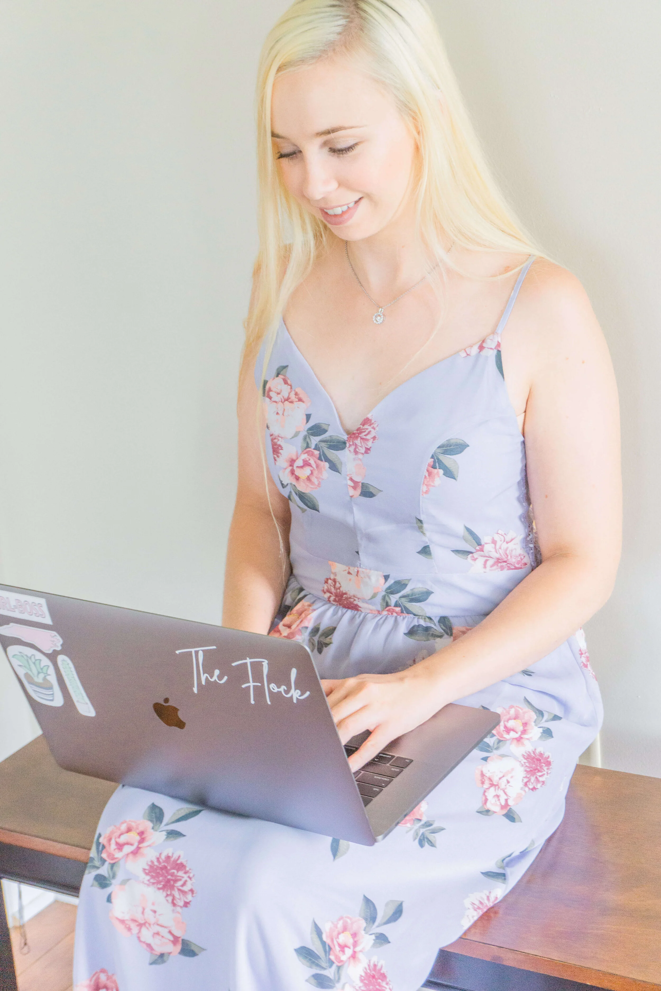 Kenzi Green Design website design working on computer