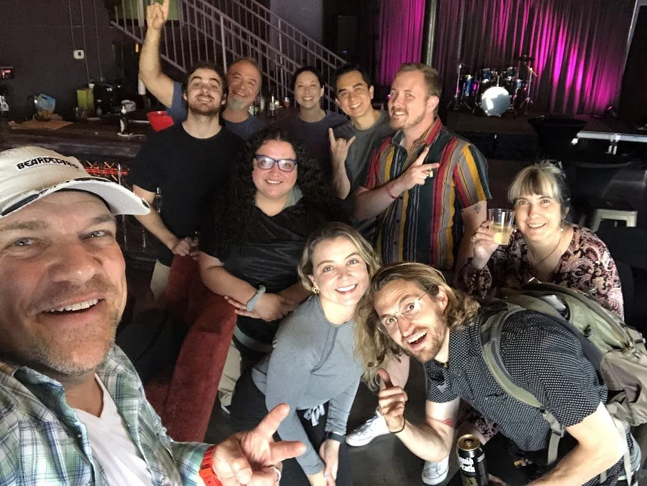 A diverse group of creative entrepreneurs and members networking at InDo Nashville, a locally-owned coworking space in the Pietown/SoBro neighborhood.