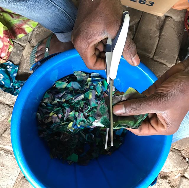 Cutting textile waste for beating into paper pulp. All the color we get in our sheets comes from cotton textile scrap pulp (cotton pulp is then mixed with the pulp mulberry fiber, giving the sheets strength).