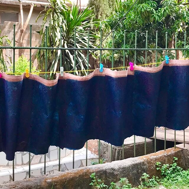 Indigo dying handmade papers - a commission for 150 academic folders for a conference for the University of Wisconsin African Studies Program.