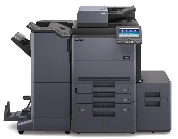 A large black and gray multifunction photocopy machine with a touchscreen control panel on the right side.