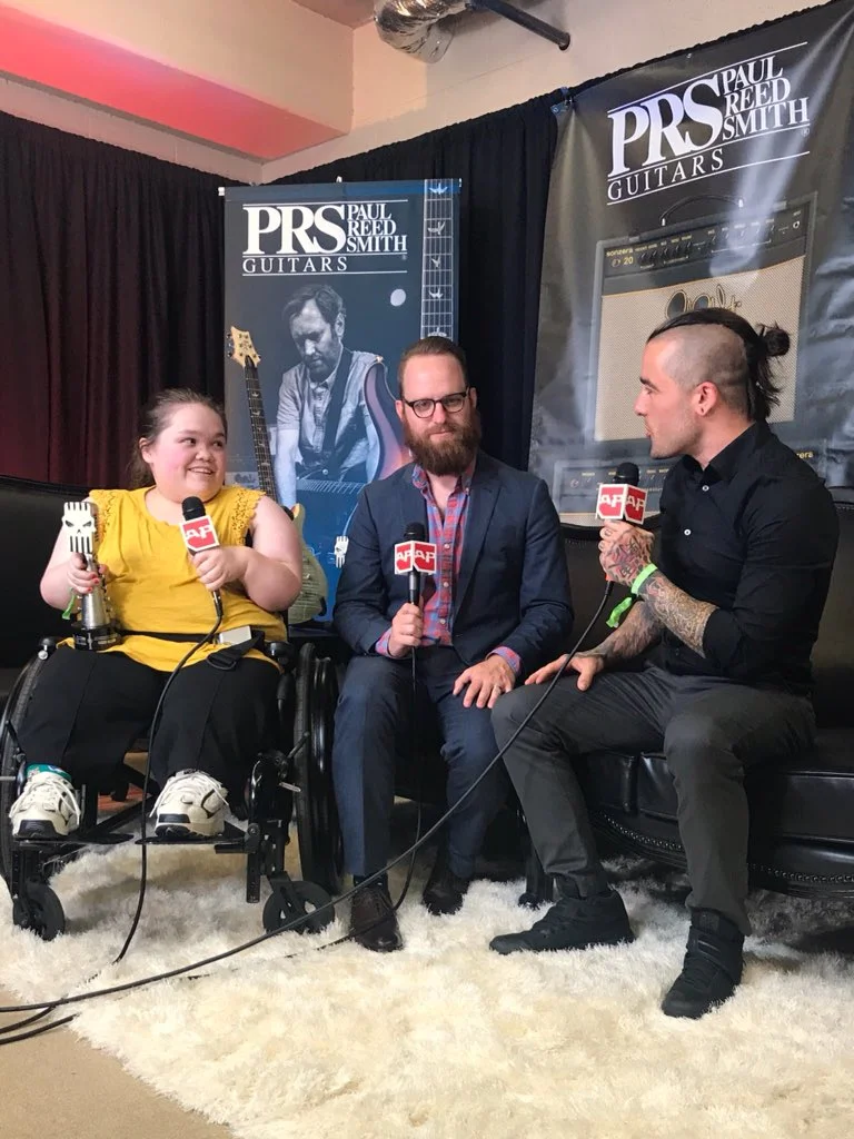 Cassie accepting the Sub City Grant at the Alternative Press Music Awards.