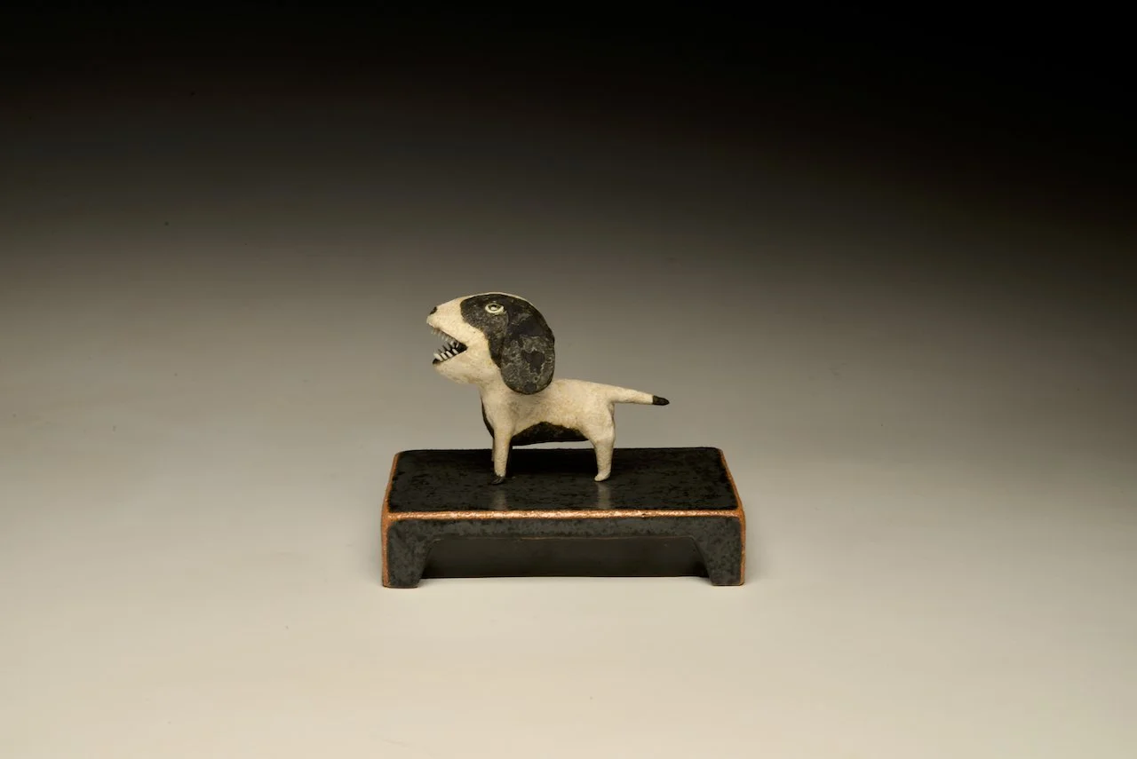 White and Black Dog on grey base — Wesley Anderegg