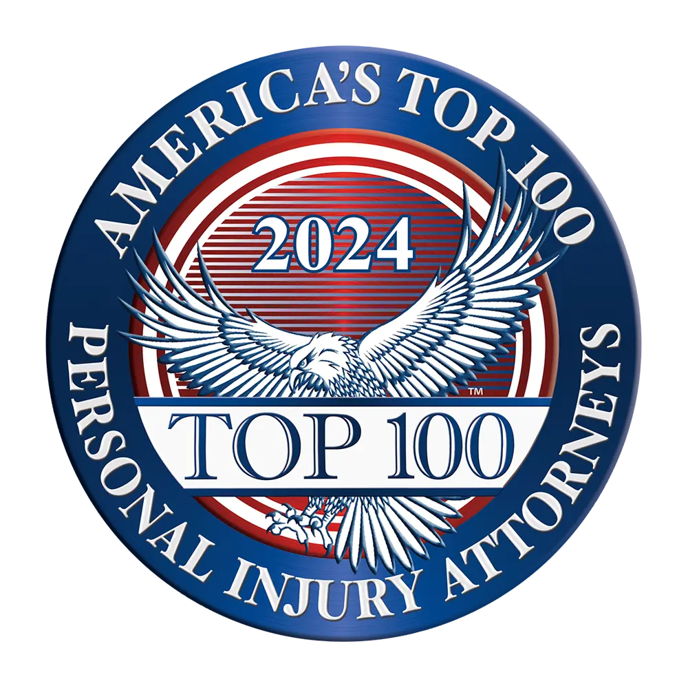 America's Top 100 Personal Injury Attorneys emblem for 2024, featuring an eagle with spread wings and a blue, red, and white color scheme.