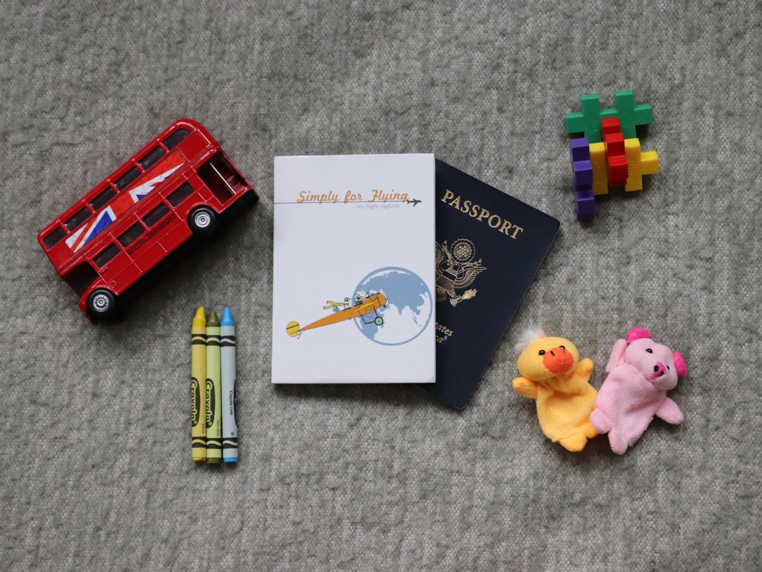 The Simply for Flying Logbook : Passport? Check. Finger puppets? Check. Logbook and a chance at business class? Check and check.
